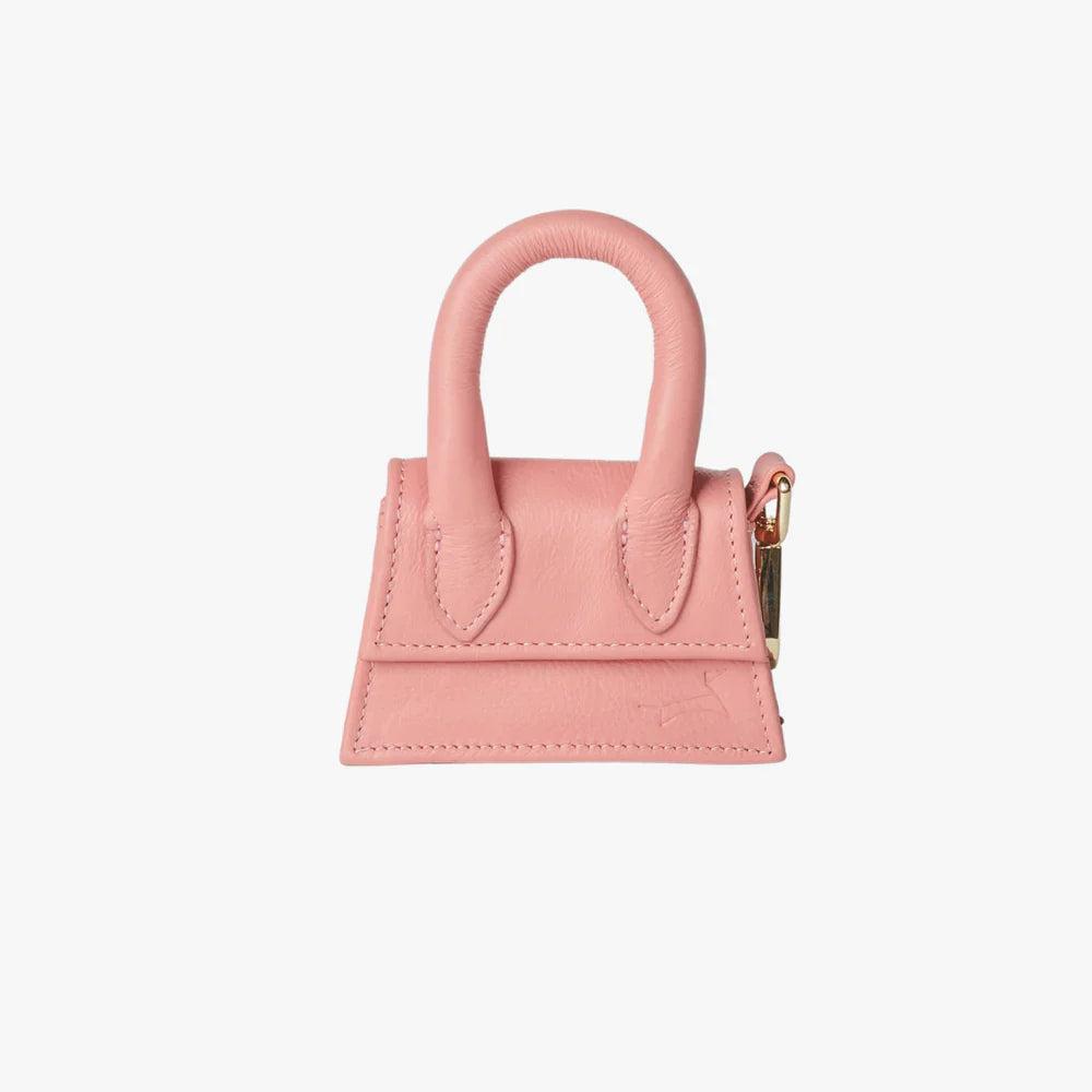 Pink designer bag for dog treats and poop bags.